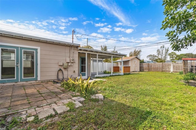 view of yard with a patio area and a shed