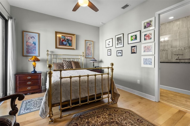 bedroom featuring ceiling fan and light hardwood / wood-style flooring