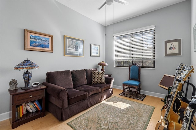 living room featuring ceiling fan and light wood-type flooring