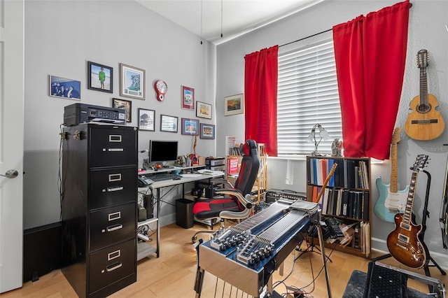 office with light hardwood / wood-style floors