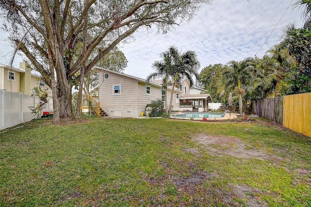 view of yard featuring a fenced in pool