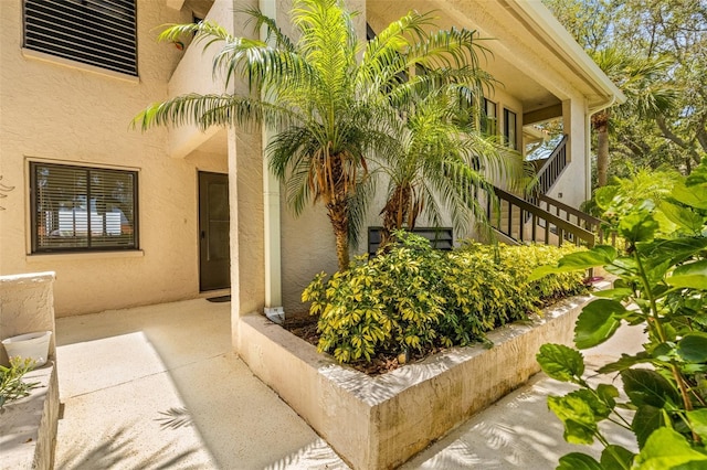 property entrance with a patio