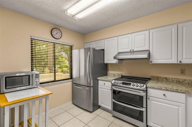 kitchen featuring stainless steel appliances, range hood, and white cabinets