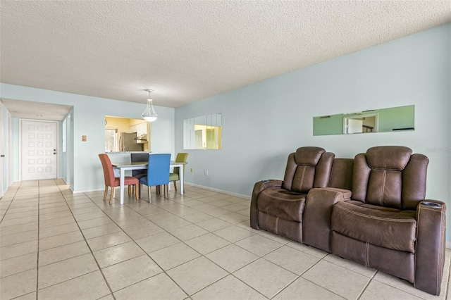 tiled living room with a textured ceiling