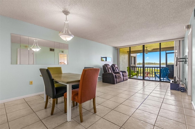 tiled dining area with a wall of windows and a textured ceiling