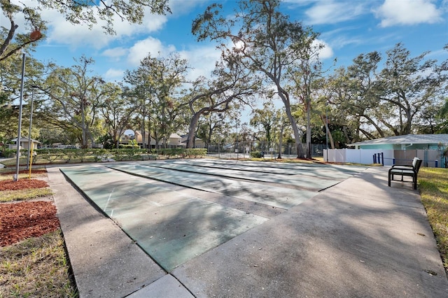 view of property's community with basketball court