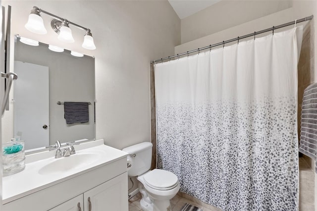 bathroom featuring vanity, a shower with shower curtain, tile patterned floors, and toilet