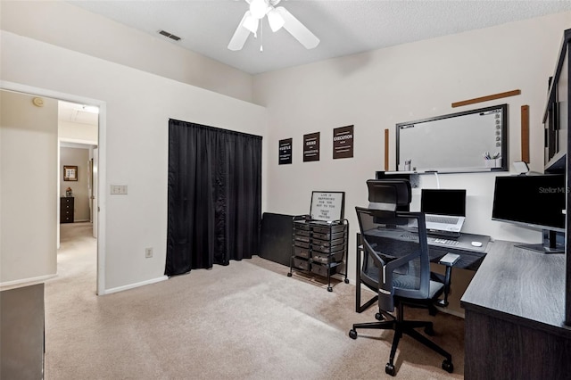 office area with light carpet and ceiling fan