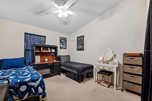 carpeted bedroom featuring ceiling fan, lofted ceiling, and a textured ceiling