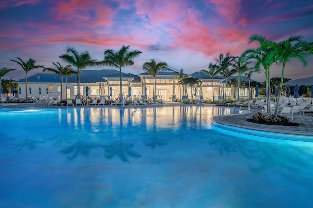 view of pool at dusk