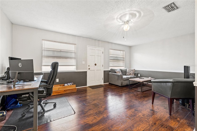 office area featuring hardwood / wood-style floors, ceiling fan, and a textured ceiling