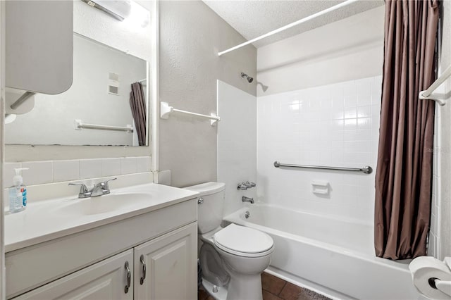 full bathroom with vanity, decorative backsplash, toilet, a textured ceiling, and shower / tub combo