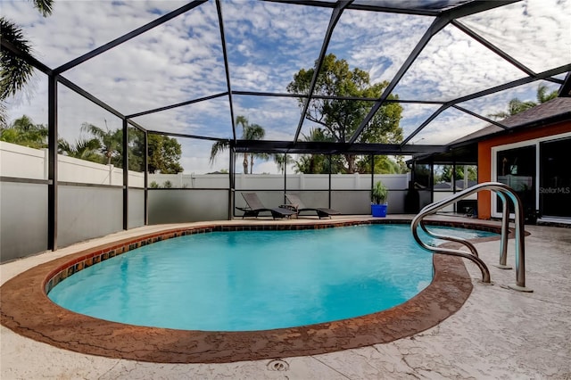 view of pool with a lanai and a patio area