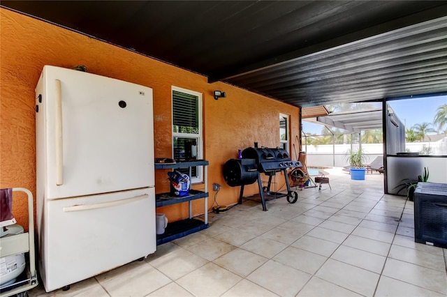 view of patio featuring a grill