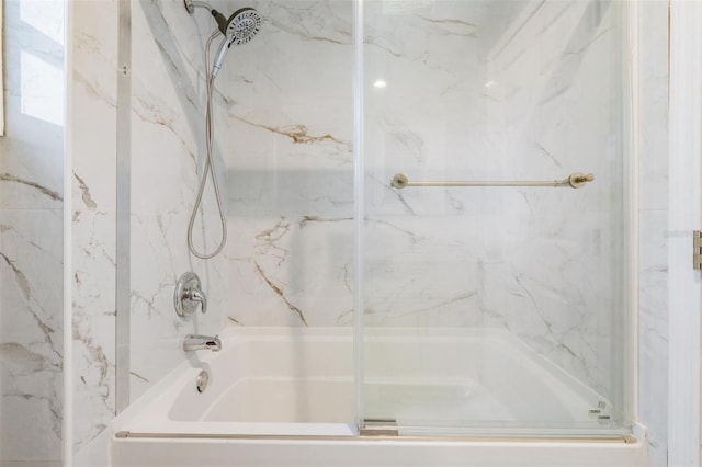 bathroom featuring shower / bath combination with glass door