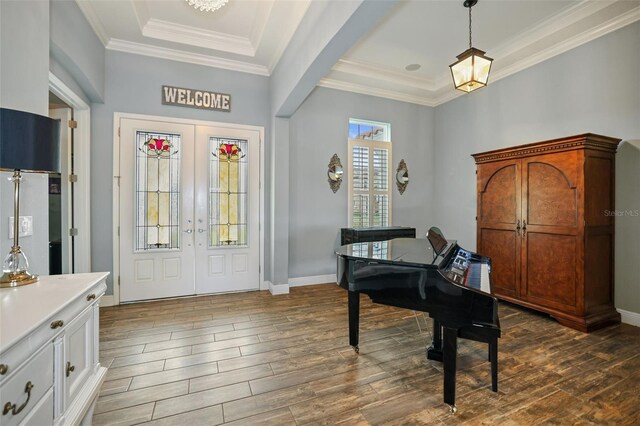 foyer featuring ornamental molding and french doors