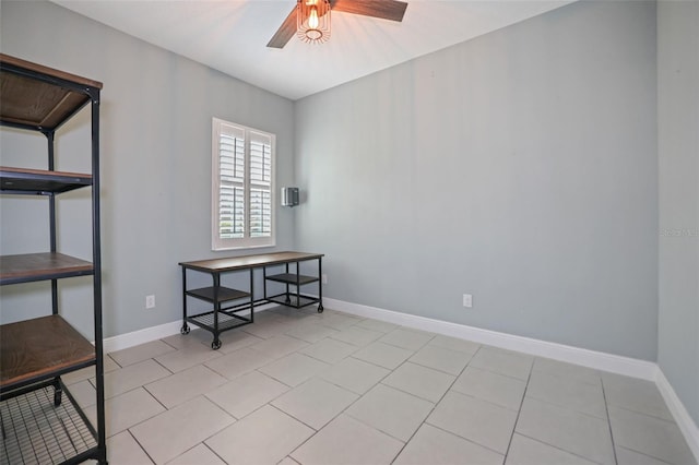 tiled empty room with ceiling fan