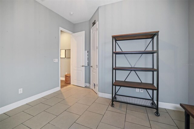 unfurnished bedroom featuring light tile patterned floors