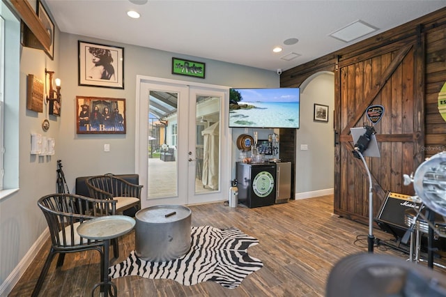 interior space with french doors and hardwood / wood-style flooring