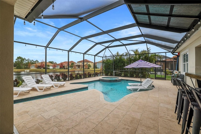 view of swimming pool featuring a lanai, a water view, a patio, and an in ground hot tub