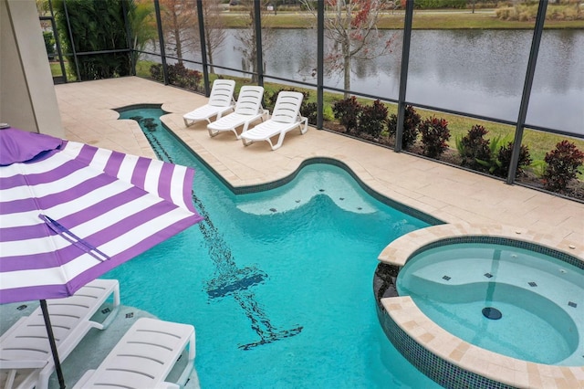 view of pool featuring glass enclosure, an in ground hot tub, and a patio