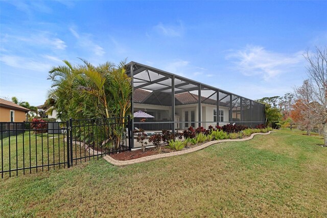 view of yard with a lanai