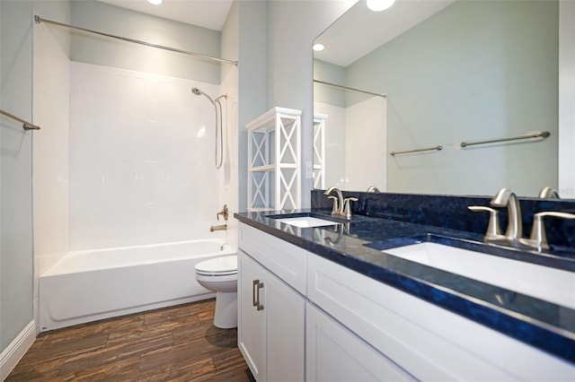 full bathroom with shower / bathing tub combination, vanity, and toilet