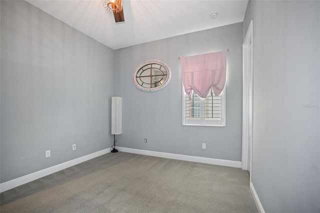 unfurnished room featuring light carpet and ceiling fan