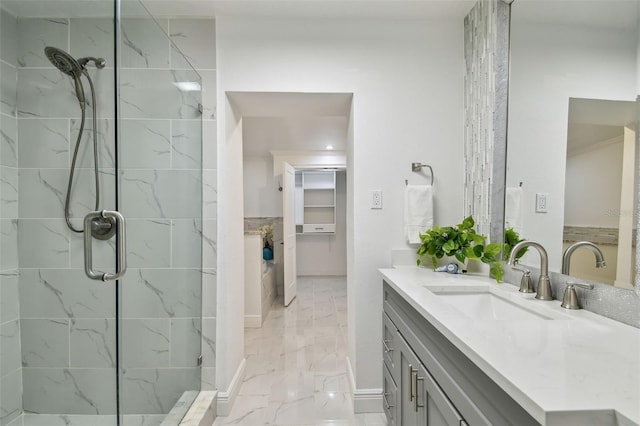 bathroom with an enclosed shower and vanity