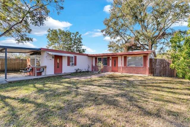 single story home with a front lawn and a patio