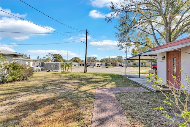 view of yard with a carport