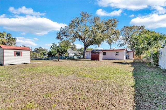 view of yard with a storage unit