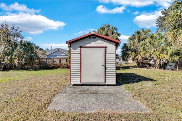 view of outdoor structure featuring a lawn