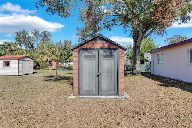 view of outdoor structure featuring a lawn