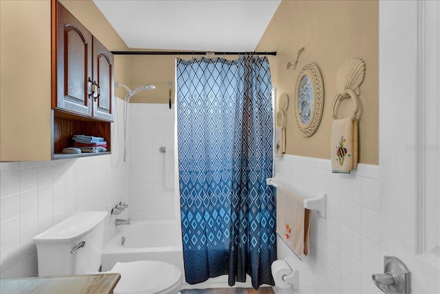 bathroom with tile walls, toilet, and shower / bath combination with curtain