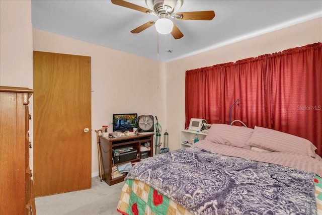 bedroom featuring ceiling fan and light colored carpet