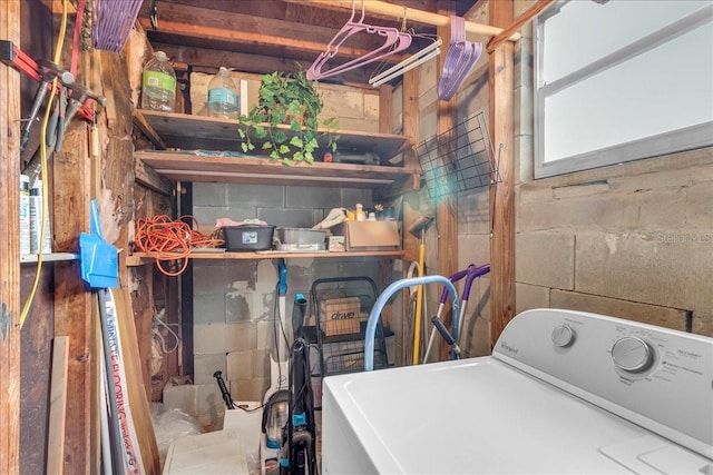 laundry area with a healthy amount of sunlight and washer / dryer