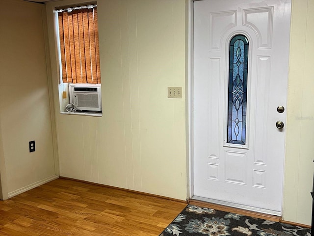 entrance foyer featuring cooling unit and light hardwood / wood-style flooring