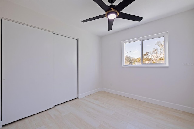 unfurnished room with ceiling fan and light hardwood / wood-style flooring