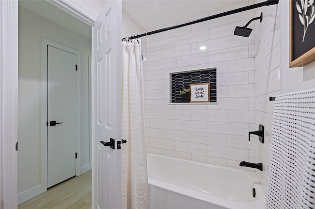 bathroom featuring shower / bath combo with shower curtain and hardwood / wood-style floors