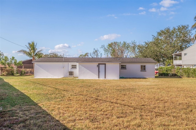 rear view of house with a lawn