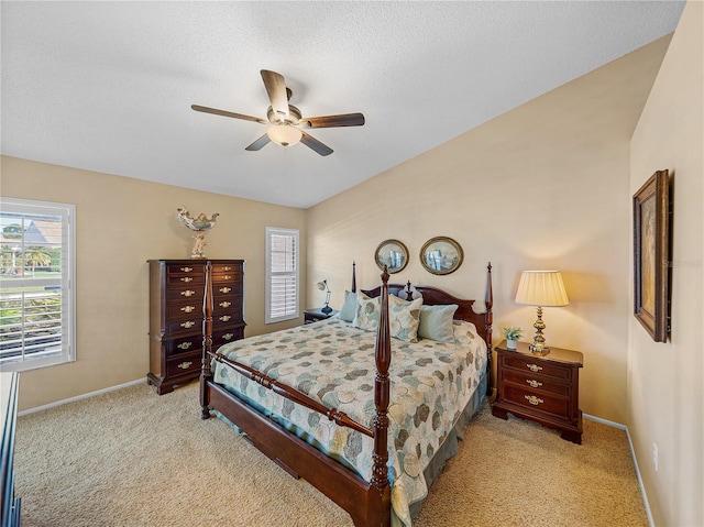 bedroom featuring ceiling fan and light colored carpet