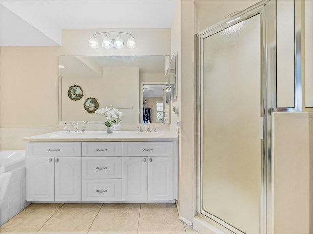 bathroom featuring tile patterned flooring, vanity, and independent shower and bath