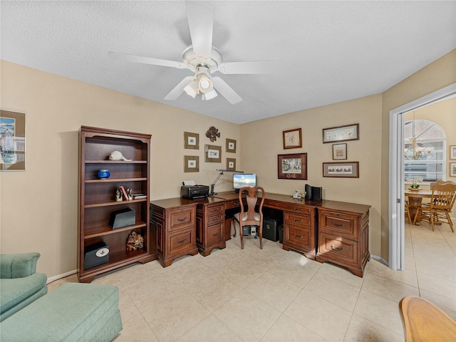 tiled office with a textured ceiling and ceiling fan