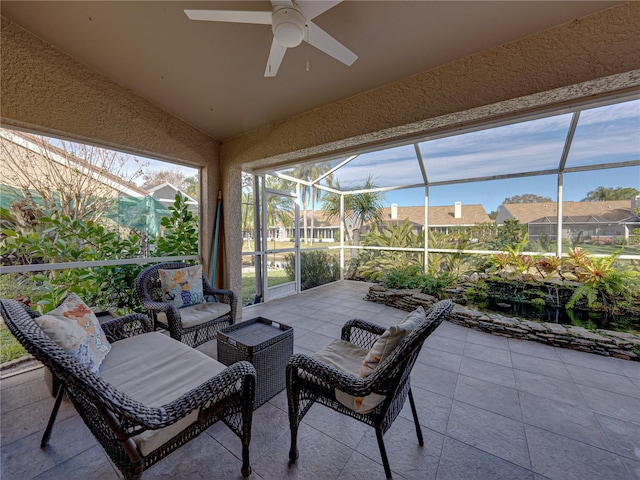 sunroom featuring ceiling fan and vaulted ceiling