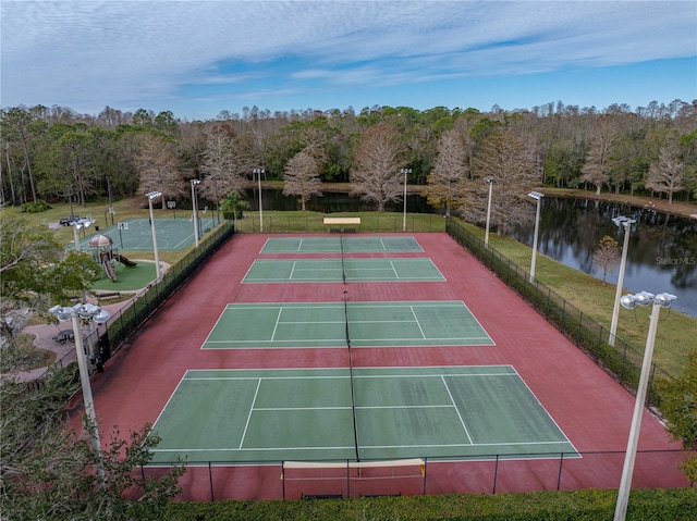 view of sport court with a water view