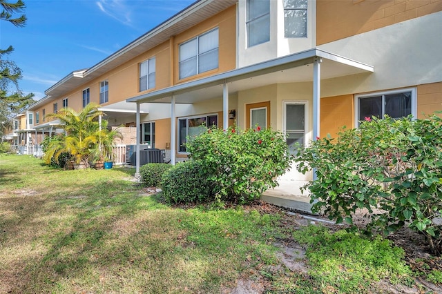 rear view of property with a yard