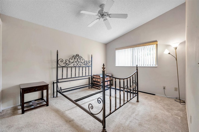 bedroom with carpet flooring, a textured ceiling, vaulted ceiling, and ceiling fan