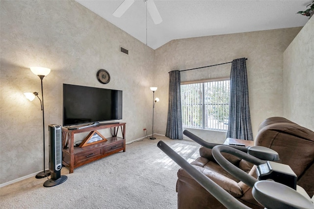 living room featuring light carpet, ceiling fan, and high vaulted ceiling