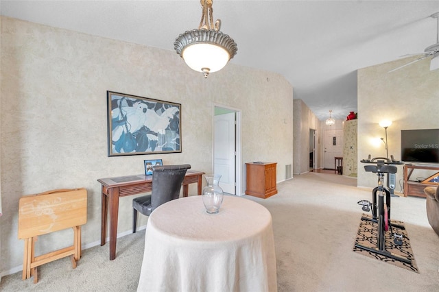 home office with light carpet, ceiling fan, and lofted ceiling